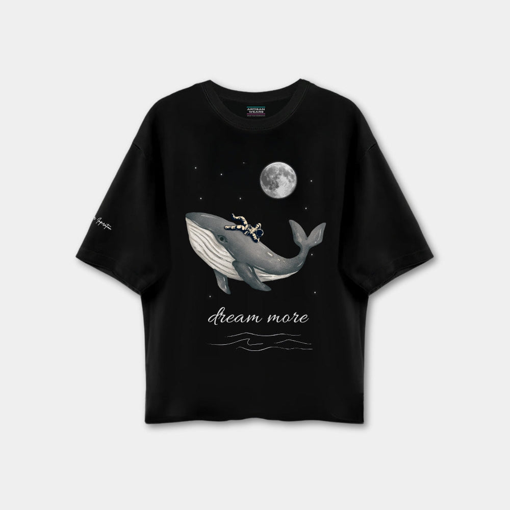 Black t-shirt with a whale graphic and 'dream more' text on a white background