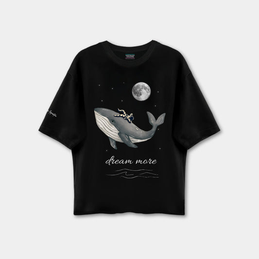 Black t-shirt with a whale graphic and 'dream more' text on a white background